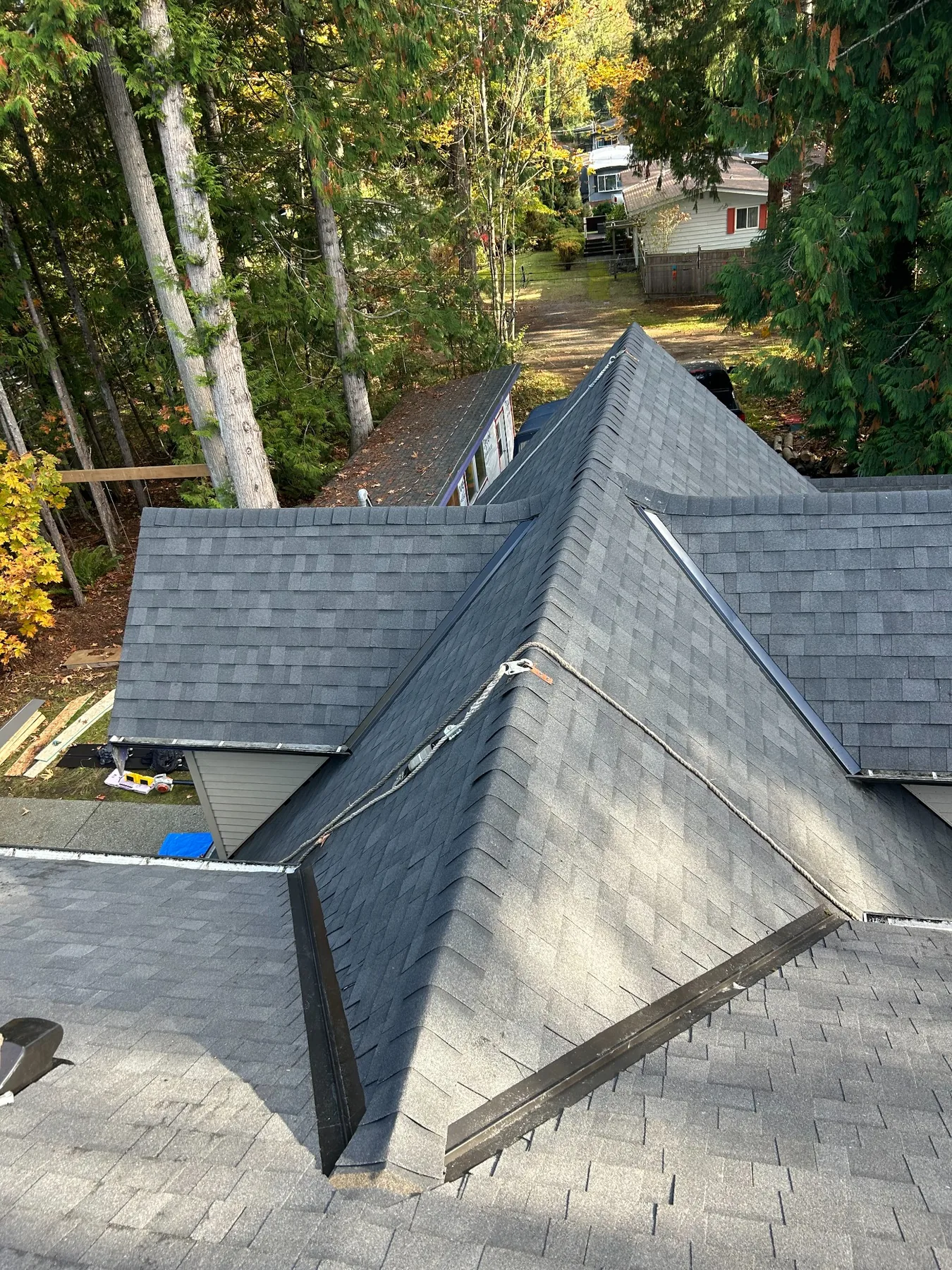 Complex asphalt shingle roof completed by Sun & Snow Roofing
